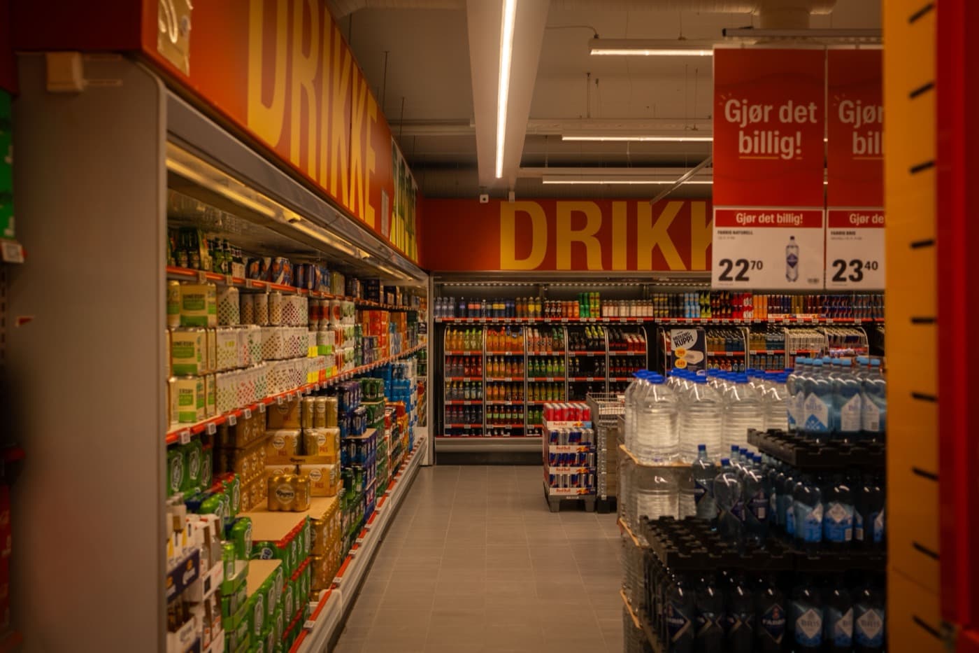 Supermarket drinks aisle with merchandise on shelves