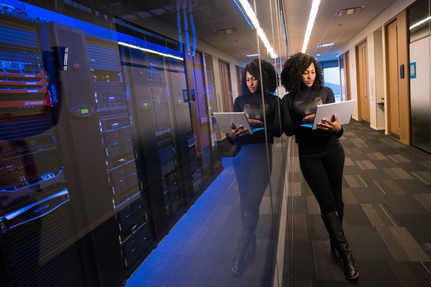Engineer with laptop in a data center
